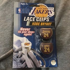 New, unopened Kobe Bryant lace clips. LAL.
